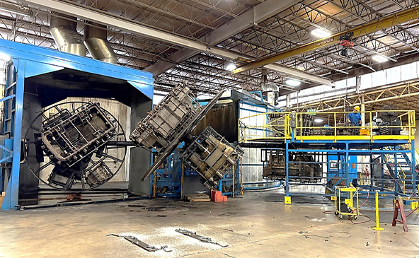 Picture of a large-sized rotational molding oven operating at RomoTech in New Paris, Indiana