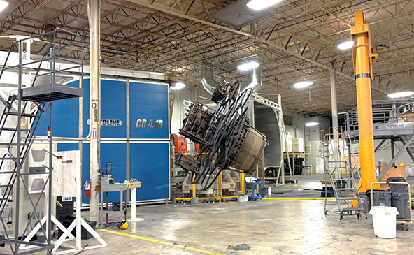 Picture of a medium-sized rotational molding oven operating at RomoTech in New Paris, Indiana